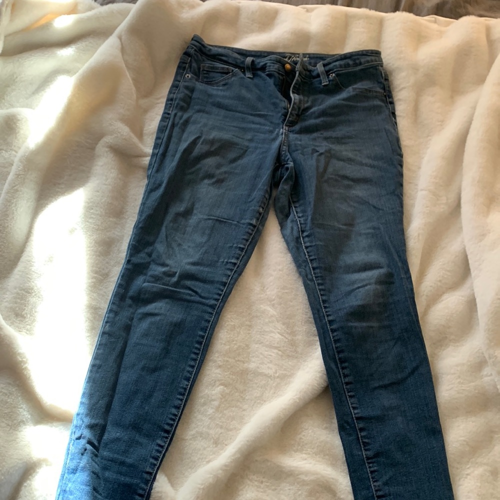 Blue skinny jeans, not see through.